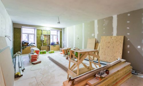 Working process of installing metal frames for plasterboard -drywall- for making gypsum walls  in apartment is under construction, remodeling, renovation, extension, restoration, upgrading and reconstruction.