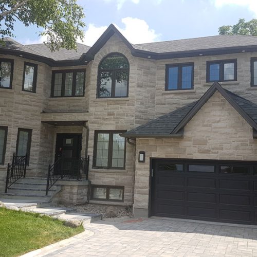 modern-home-with-bow-windows-and-front-door-stairs-build-your-dream-house-with-black-pearl